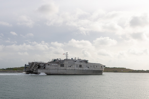 Cape Canaveral, Florida, USA - June 7, 2021: USNS Newport underway in Port Canaveral. Florida. The fast transport United States Navy is operated by the Military Sealift Command vessel. It was put into service in September 2020.