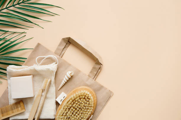 istock Eco-friendly bathroom accessories: bamboo toothbrushes, bamboo ear sticks, organic soap, reusable cotton bags on beige background. Responsible consumption concept. Spa, skin care. Copy space. 1322525566