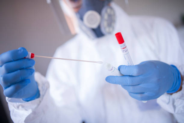 istock COVID-19 swab sample, female doctor making test. 1322525873