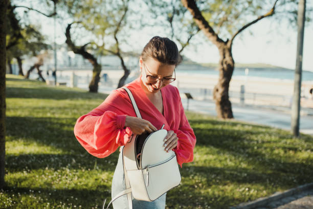 istock Young woman searching in her purse 1322530929
