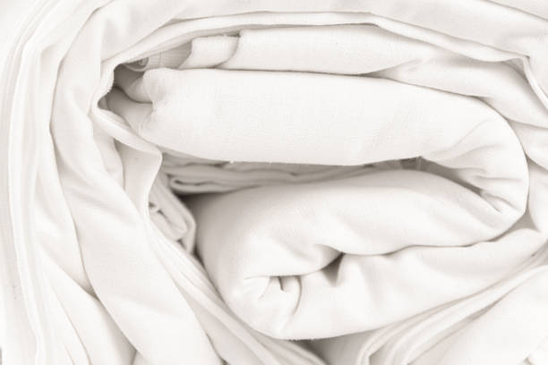 istock Roll of white fabric, view from end 1322531651