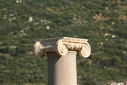 Antalya, Turkey-April 25, 2013: Macro shot of the column capital in the ruins of Patara Ancient City.