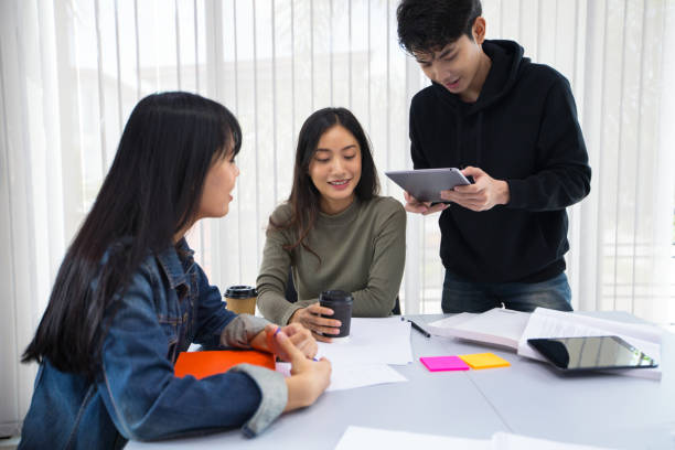 istock Asian students read books and use digital tablets to find information for work and online studies 1322534004