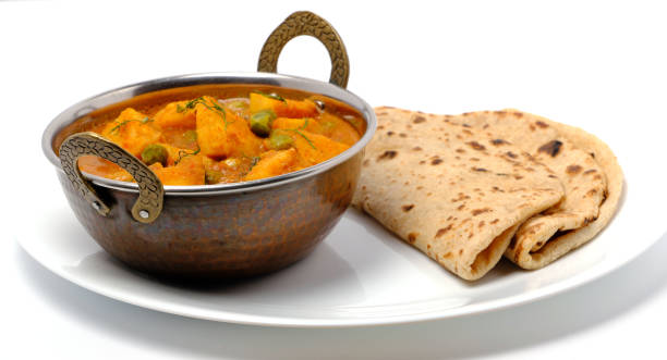 istock Indian style cottage cheese dish or curry with roti 1322536103