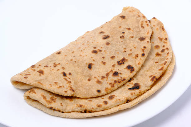 istock Indian style bread or roti served in a plate 1322536159