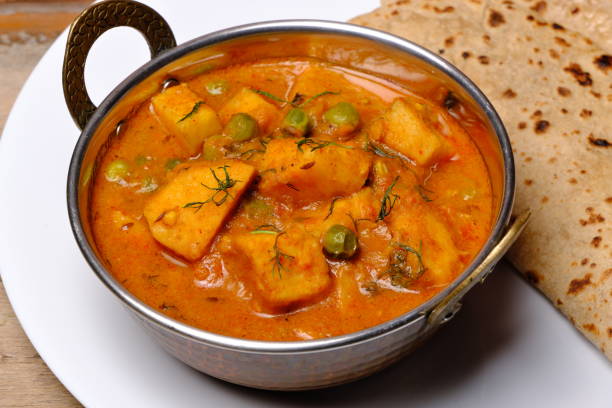 istock Indian style cottage cheese dish or curry with roti 1322536313