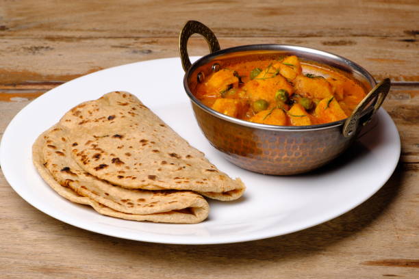 istock Indian style cottage cheese dish or curry with roti 1322536899