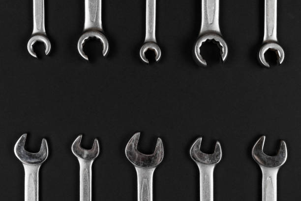 istock Wrenches, spanners on black paper background 1322537306