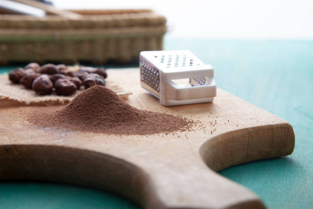 ground cocoa on wooden board with cocoa beans