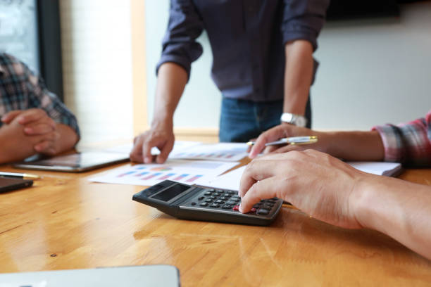 istock Team Businessmen are meeting for calculating and analyzing performance statistics for future investments.coordinate concept. 1322538271