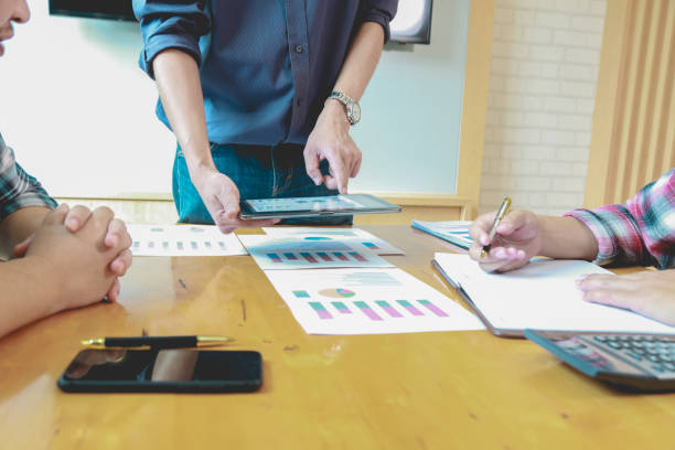 istock Team Businessmen are meeting for calculating and analyzing performance statistics for future investments.coordinate concept. 1322538315