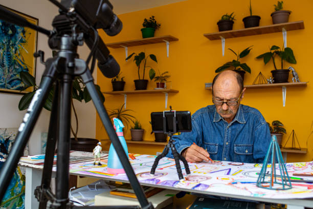 istock Senior artist drawings 1322539571