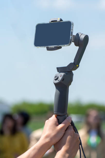 istock Handheld smartphone stabilizer in the hands of a blogger 1322540881