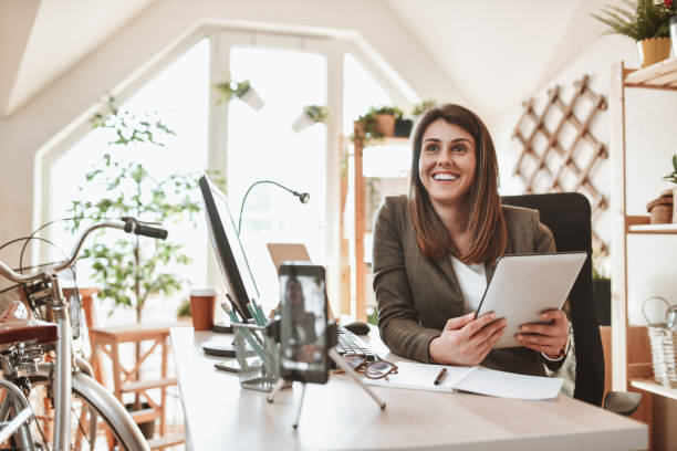 istock Happy Female Office Worker Making Video Vlog About Business 1322541026