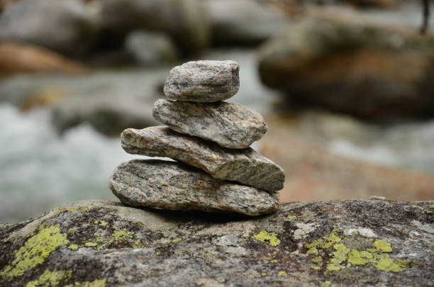 istock Stack rocks, pile rocks close up next to river in the mountains 1322547144