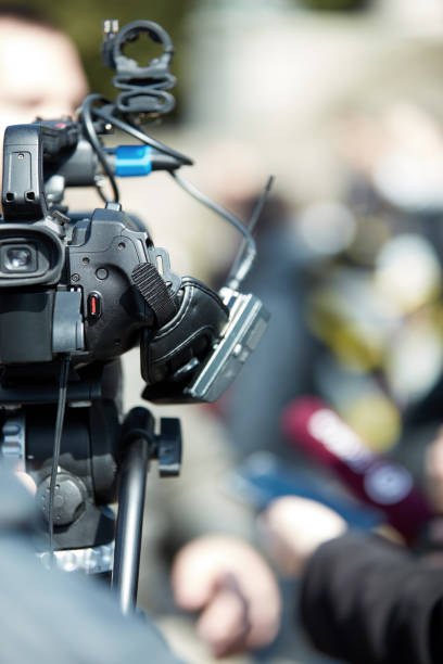 istock News broadcasting and recording protest on the streets. 1322547748