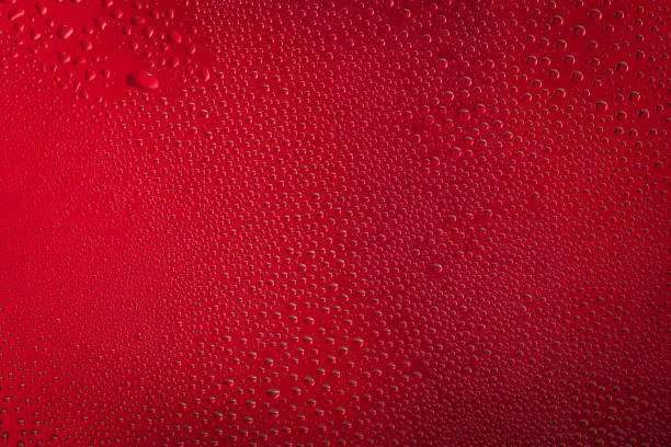 istock Background of red water drops on glass. 1322547868