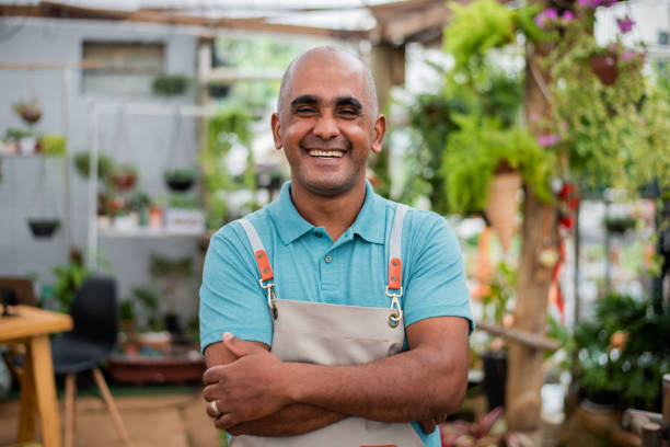 istock Small businessman smiling looking at camera. 1322549796