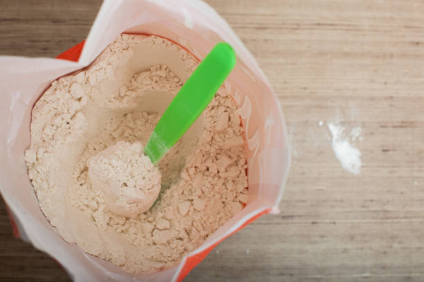 istock Opened package with flour and spoon inside on the kitchen table for cooking various dishes 1322553988