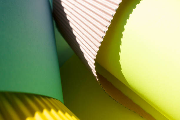istock Coral Colored ,beige,green and yellow Curled papers background. 1322559173