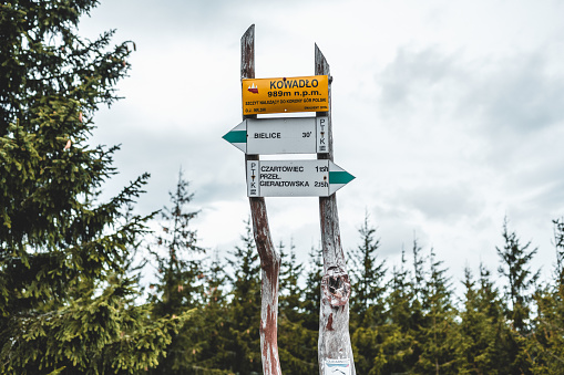 Signpost on the top of Kowadlo in the Golden Mountains, it's one of the 28 peaks of Crown of Polish Mountains, one per each of the mountain ranges of Poland.
