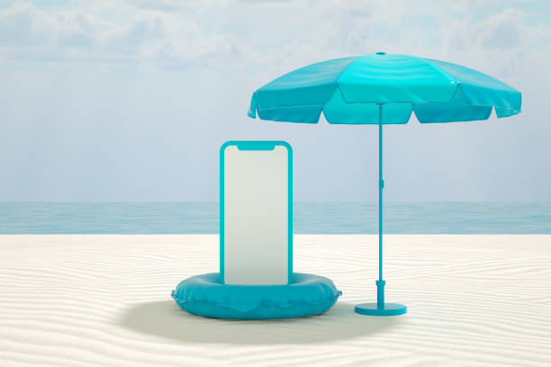 istock Empty Screen Smart Phone on Beach, Minimal Summer Holiday Travel Concept 1322563395