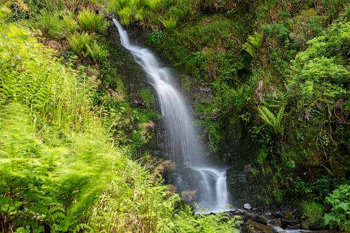 Long exposure of the Hollowbrook waterfall on the South West Coastpath from Woody Bay to Heddons Mouth in Devon