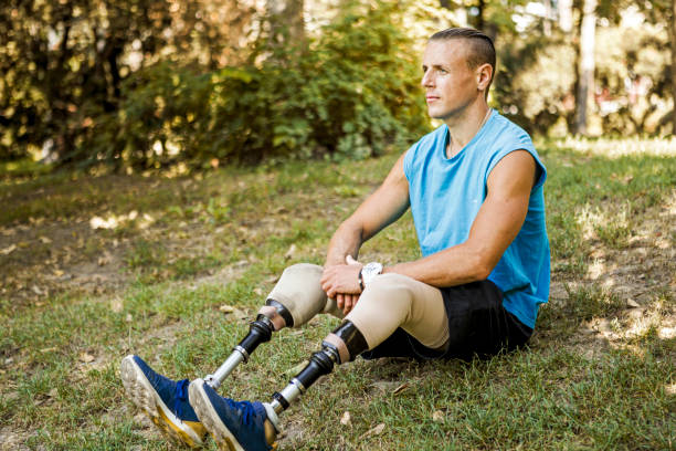 istock Disability man sitting in public park 1322565198