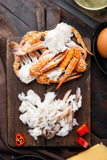 istock Chilli crab silky omlette ingredients, on dark wooden background, top view flat lay 1322565557