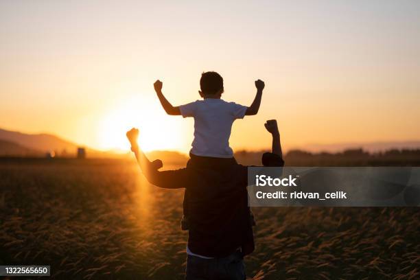 Dad And Son Outdoors Stock Photo - Download Image Now - Strength, Father, Child
