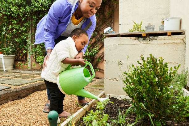 istock Mother and daughter gardening together 1322566678