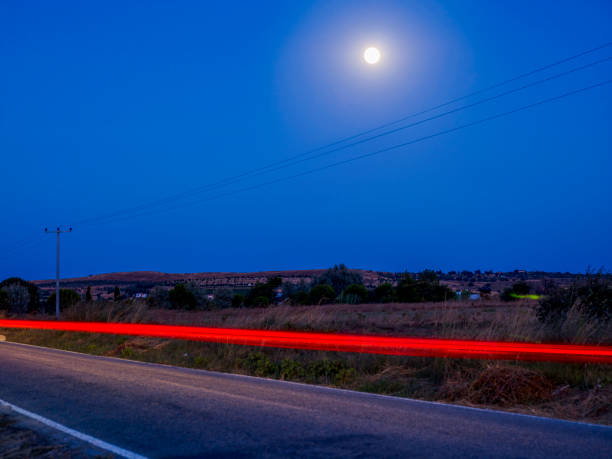 Long exposure photo of traffic on Long exposure photo of traffic on m40 sniper rifle stock pictures, royalty-free photos & images