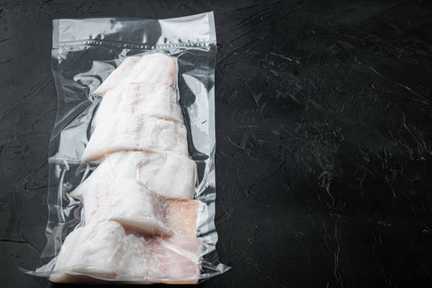 istock Haddock white fish fillet in plastic market pack, top view with copy space for text 1322570451