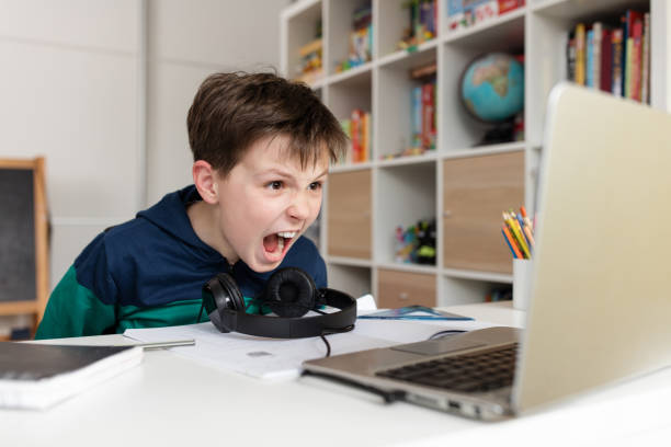 Homeschooled boy under stress 4th grader having problem during video conference class report card stock pictures, royalty-free photos & images