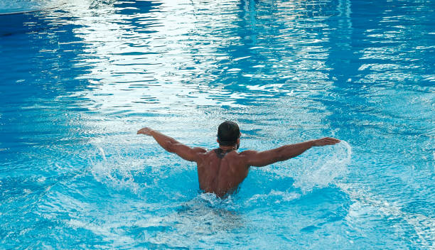 istock Swimmer athlete training butterfly stroke in swimming pool 1322572788