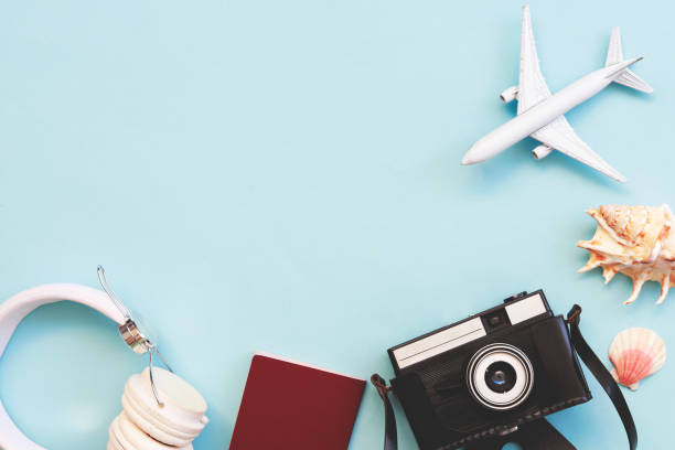 Travel accessories with copy space on blue background