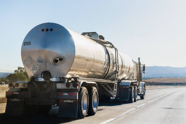 tanker truck driving on the freeway - fuel tanker imagens e fotografias de stock