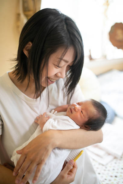 istock New born baby relaxing with mother 1322579628