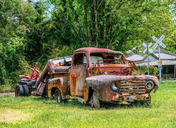 istock Old Rusty Truck by Railroad Crossing 1322584257
