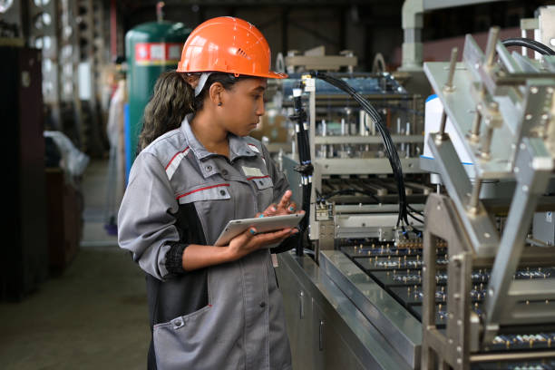 istock A young black manufacturing worker controls an assembly line in a factory 1322585685