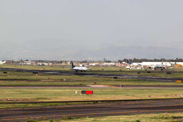 istock Airplane settling on runway to take off or land 1322588241