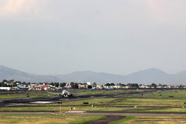 istock Airplane settling on runway to take off or land 1322591363