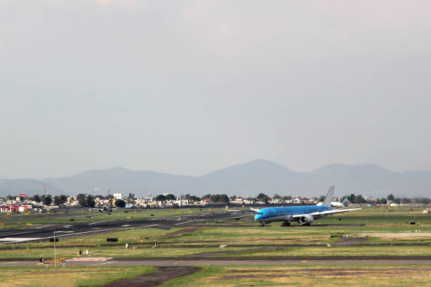 istock Airplane settling on runway to take off or land 1322591369