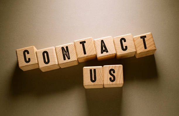 istock Contact Us Word with Wooden Cubes 1322593133