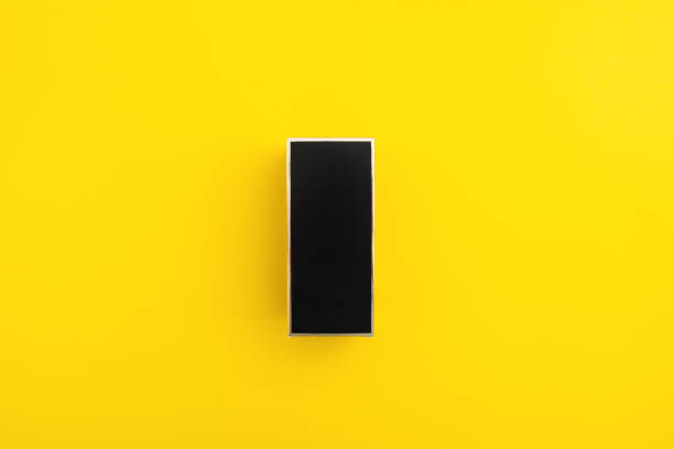 istock Black box with golden stroke panel over yellow background 1322594350
