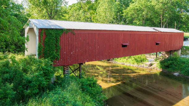 Cades Mill Covered Bridge Cade’s Mill bridge is located in Fountain County in west central Indiana, south west of the town of Veedersburg. It was built in 1854, of Howe Truss type construction, and crosses Coal Creek. indiana covered bridge stock pictures, royalty-free photos & images