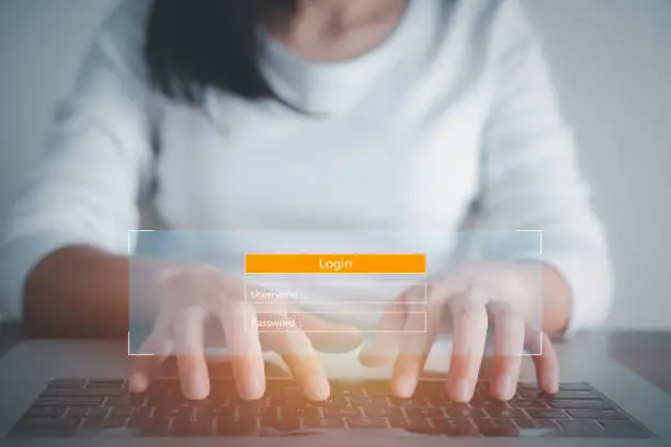 Photo of Woman using access window to log in entering password on laptop, Sign up username password Enter log in, Cyber protection, Information privacy. Protection Internet and technology Concept.