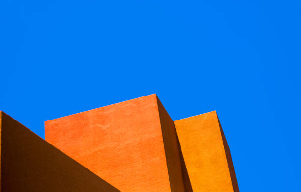 santa fe style: modern adobe building exterior detail, blue background - orange wall imagens e fotografias de stock