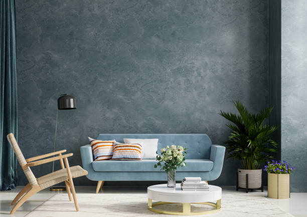 istock The interior room with sofa and armchair on empty dark blue concrete wall background. 1322602075
