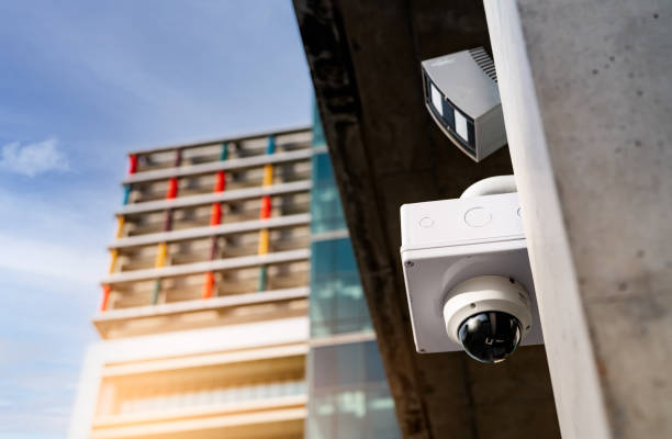 istock CCTV security camera video system for safety installed outside office building. Closed circuit television . CCTV electronic security system. Police equipment. Video surveillance camera technology. 1322608182